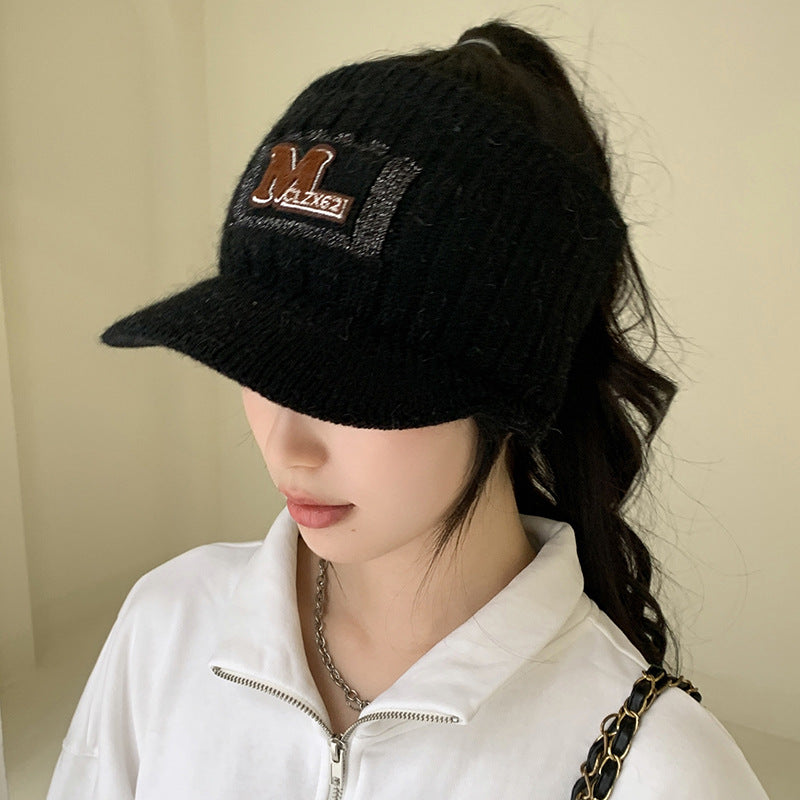 Autumn and winter new empty top fleece letter hat women's outdoor sports show face small warm leak ponytail knit hat